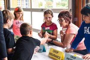 Students and AITC volunteer at Kelburn Farm.