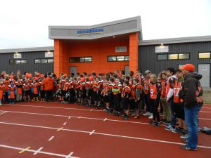 Minor sports members & sponsors in front of the Richardson Community Clubhouse.